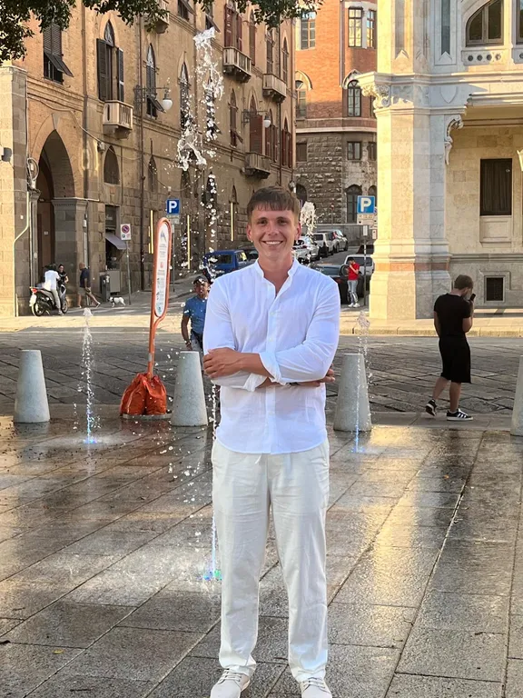 Kamil Rogozinski standing in a city square